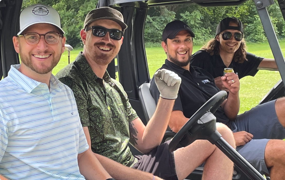 Employees enjoying a golf outing.